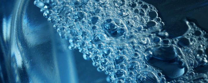 Fragment,Of,Transparent,Plastic,Bottle,Containing,Blue,Foaming,Liquid,For