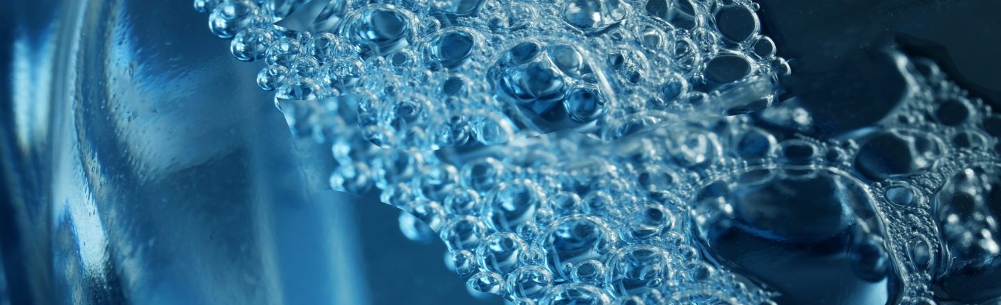 Fragment,Of,Transparent,Plastic,Bottle,Containing,Blue,Foaming,Liquid,For